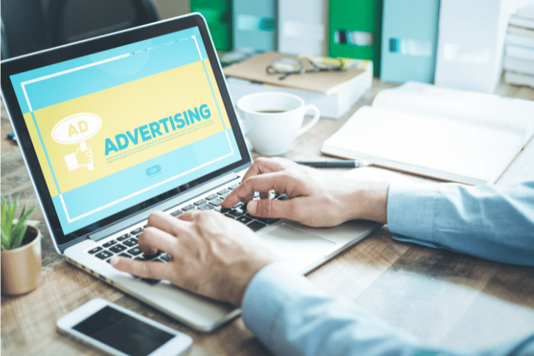 Digital advertising strategic planning with laptop